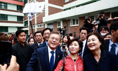 Moon Jae-in takes a selfie with a supporter