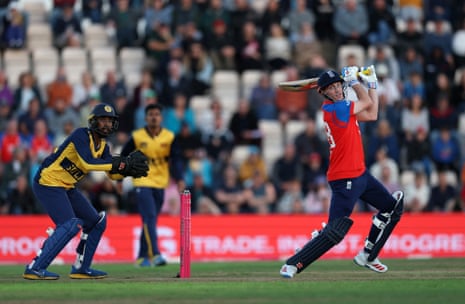 England's Harry Brook watches the ball after playing a shot.