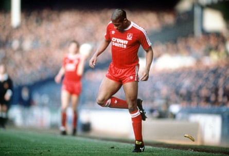 Liverpool’s John Barnes backheels a banana that was thrown on to the pitch by a racist section of the crowd. 21st February 1988, FA Cup Fifth Round, Goodison Park, Everton 0 v Liverpool 1