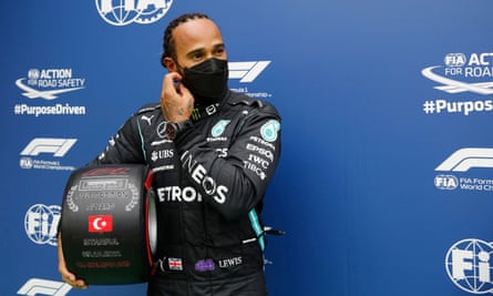 Lewis Hamilton takes the trophy for finishing fastest in qualifying but will not be on pole position