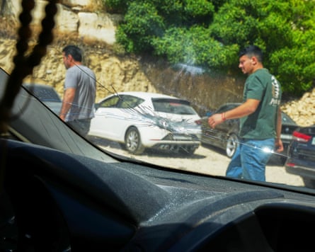 A bullet hole in car windscreen, seen from inside the car