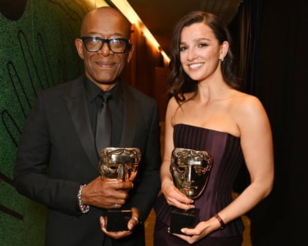 Lennie James and Marisa Abela standing side by side holding their trophies