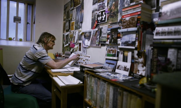 An inmate reads in his cell