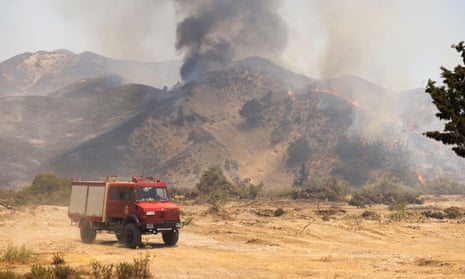 Firefighters tackle wildfires on the Greek island of Rhodes