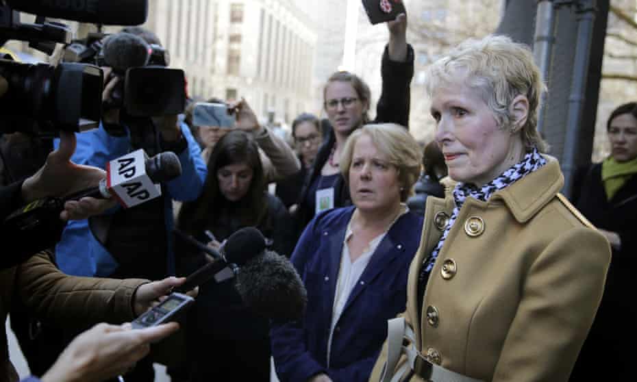 E Jean Carroll, right, talks to reporters outside a courthouse in New York in March 2020.
