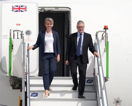 Yvette Cooper and Keir Starmer getting off a plane