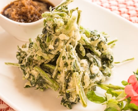 Watercress tempura on a rectangular plate