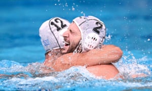 The Greek water polo players Konstantinos Genidounias and Angelos Vlachopoulos celebrate after beating Hungary in the semi-final at the Tokyo Olympic Games.