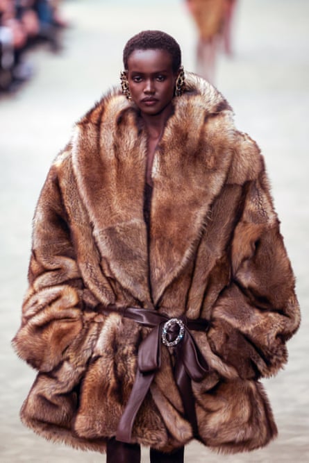 A model wearing a large furry coat