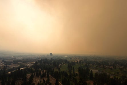 Smoke from the McDougall Creek wildfire envelops Kelowna, British Columbia, on Friday