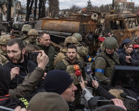 President Volodymyr Zelenskyy speaks to the media in Bucha, outside Kyiv in 2022.