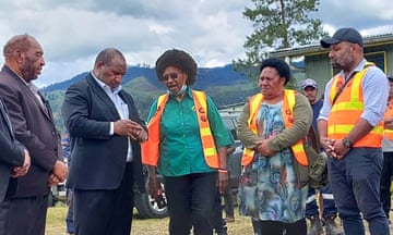 PPapua New Guinea's prime minister, James Marape, (second left) talking with officials at the site of a landslide at Yambali village on Friday.