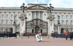 Buckingham Palace. Artist Kaya Mar holds a portrait he has painted of the Duke of Edinburgh