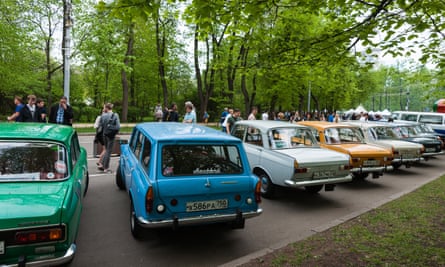 A show of vintage cars including Moskvich and motor cycles in Sokolniki amusement park.