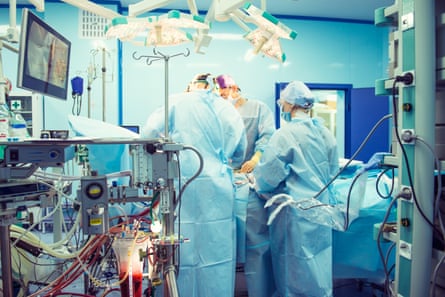A team of surgeons working on a patient