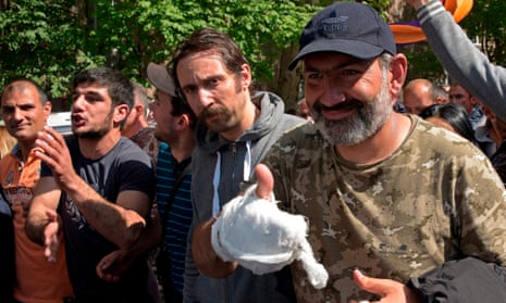 The leader of Armenia’s mass anti-government protests Nikol Pashinyan (R) meets supporters upon his release in Yerevan on Monday.