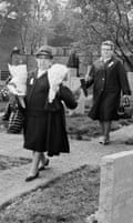Mourners carrying flowers at the Cannock Chase German Military Cemetery in 1967