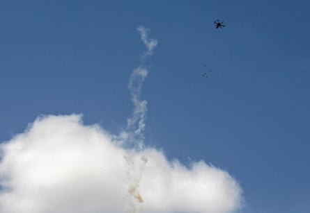 A drone drops teargas canisters