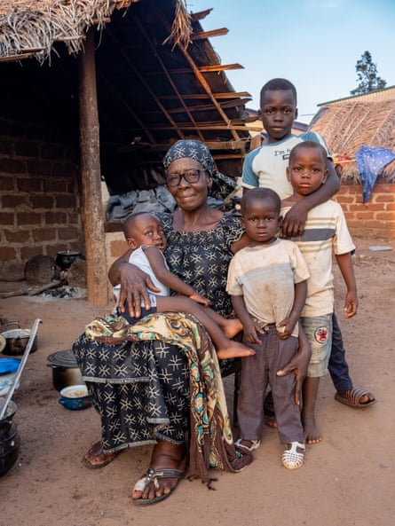 Lailou, 68 years old, has three children, one son and two daughters, and 6 grandchildren. She is pictured with four of her grandchildren.