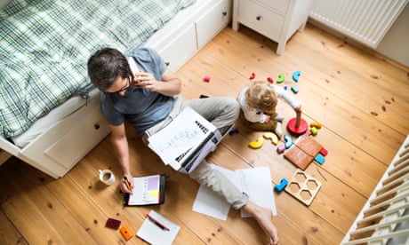 Father with his son working from home during the pandemic.
