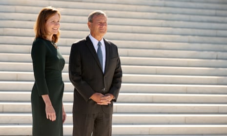 John Roberts with Amy Coney Barrett by the supreme court last week.
