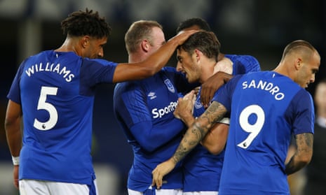 Leighton Baines is congratulated by his Everton team-mates after scoring the only goal of the match.