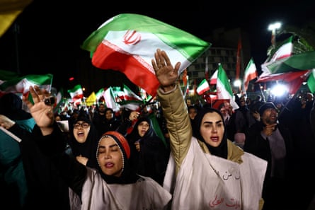 People march at an anti-US and Israel rally in Tehran