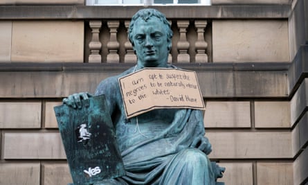 A sign hangs from the statue of the 18th-century philosopher David Hume in Edinburgh after a Black Lives Matter protest in June.