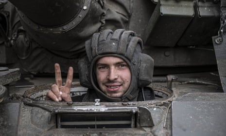 A Ukrainian soldier seen from a tank on the Kherson front in Ukraine on 9 November.