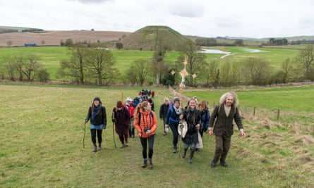 The pilgrims on Waden Hill, with Silbury Hill behind. Guides Chris and Charlotte are front right.