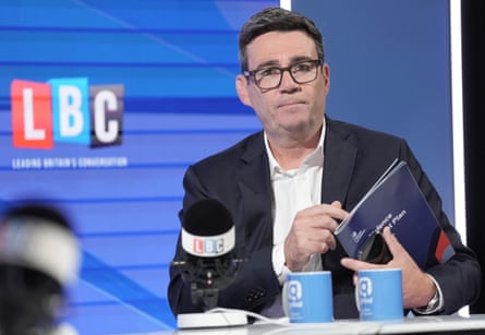 Andy Burnham holds copy of Dip on LBC