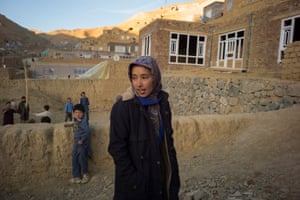 Najiye Mohammadi, 17, walks through her neighbourhood in Bamyan a few days before competing in the Afghan Mountain Challenge.