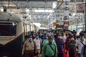 Kolkata, India. Passengers disembark from local trains following the resumption of services in west Bengal after being closed for nearly eight months due to coronavirus