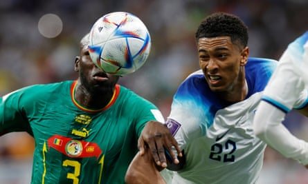 Jude Bellingham battles Senegal's captain, Kalidou Koulibaly, for the ball