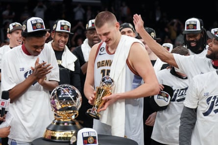 Nikola Jokić celebrates after receiving his MVP trophy for the Western Conference finals.