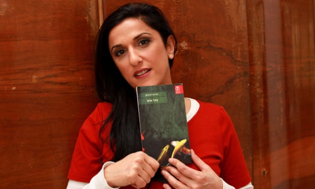 Israeli author Dorit Rabinyan with her book Borderlife. 