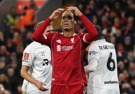 Liverpool’s Virgil van Dijk reacts after missing a chance to score against Barnsley.