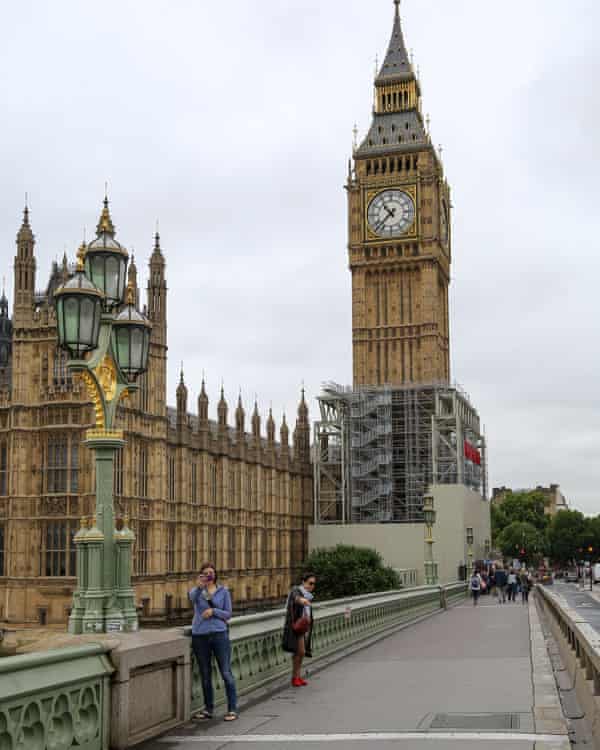 People take selfies with Big Ben before the bell falls silent for a period of repair work.