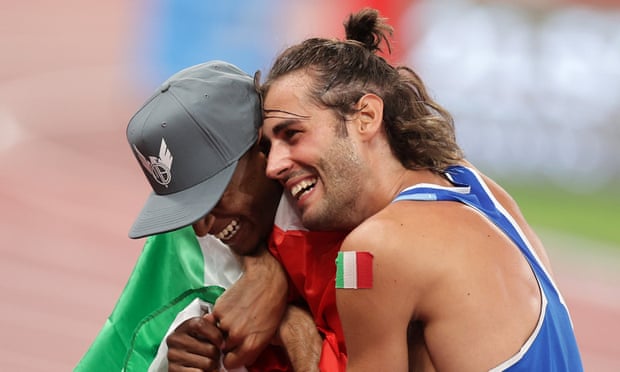 Mutaz Essa Barshim of Qatar and Gianmarco Tamberi of Italy celebrate after winning gold in the men’s high jump final at Tokyo 2020 Olympic Games