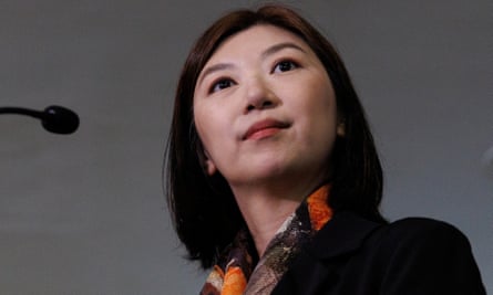 Legislator Eunice Yung, daughter-in-law of Elmer Yuen, speaks to the media after being taken to the police station for investigation, in Hong Kong on 24 July.