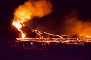 Reykjavik, Iceland: Hikers look at lava flowing from the erupting Fagradalsfjal volcano, which erupted for the first time in 800 years.