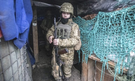 A Ukrainian soldier in a trench at Mariupol, in the Donetsk region of Ukraine.