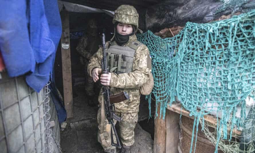 A Ukrainian soldier in a trench at Mariupol, in the Donetsk region of Ukraine.