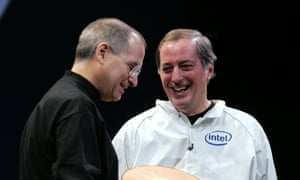 Former Apple CEO Steve Jobs, left, smiles with former Intel Corp CEO Paul Otellini during the MacWorld conference in 2006, the year Intel processors were introduced to Mac computers.