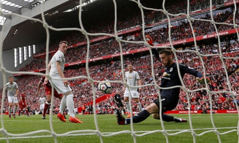 Man United’s David De Gea makes a save from Liverpool’s Georginio Wijnaldum.