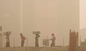 Labourers work on a Delhi construction site.