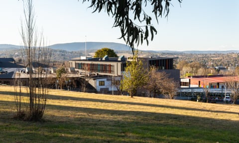 A landscape view showing the exterior of Armidale Secondary College with grass in the foreground