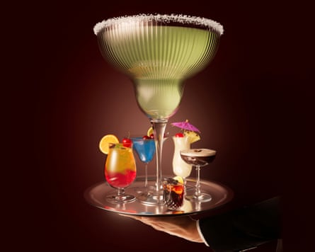 A hand holding a tray of cocktails, with a margarita towering over the rest