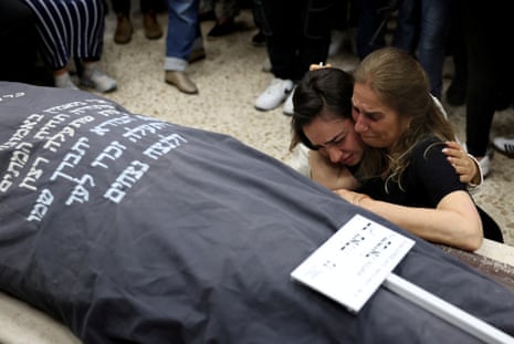 Relatives and friends of Tzeela Gez, who was shot dead in the West Bank while driving to hospital with her husband to give birth, mourn during her funeral in Jerusalem, May 15, 2025.