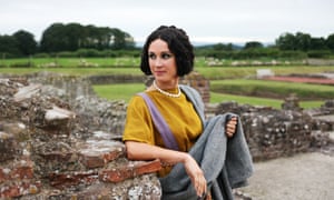 A woman in Roman British-style dress and makeup
